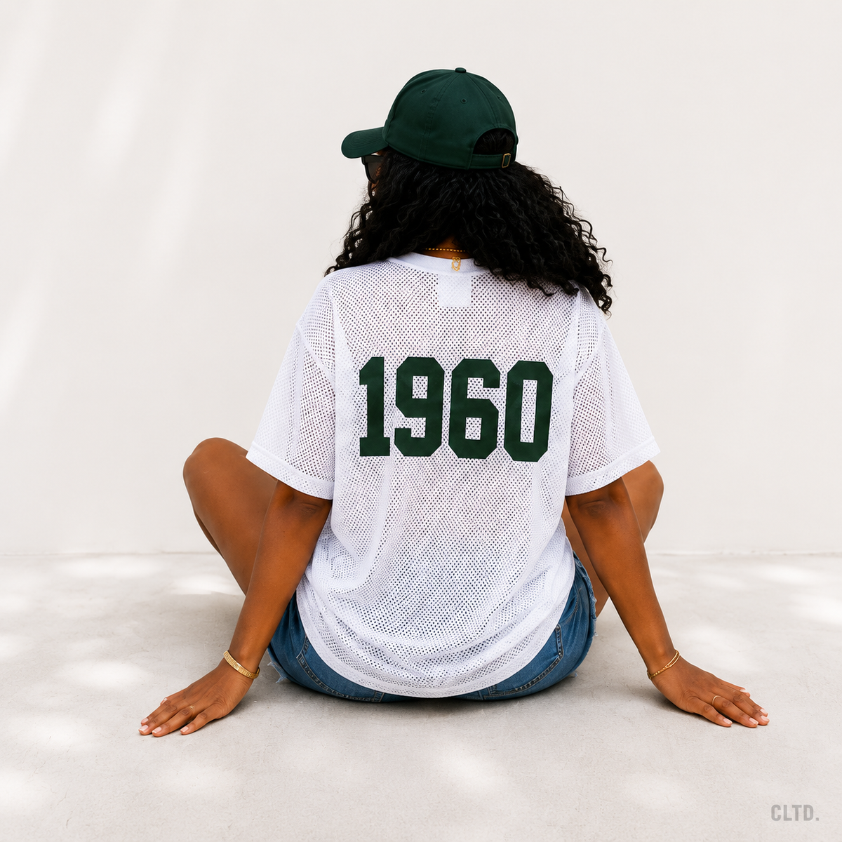 Naija 1960 white mesh jersey – women’s seated back view