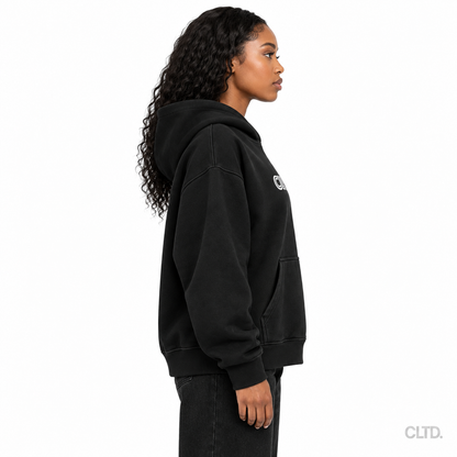 Female model wearing Cultured black heavyweight hoodie side view with CLTD watermark