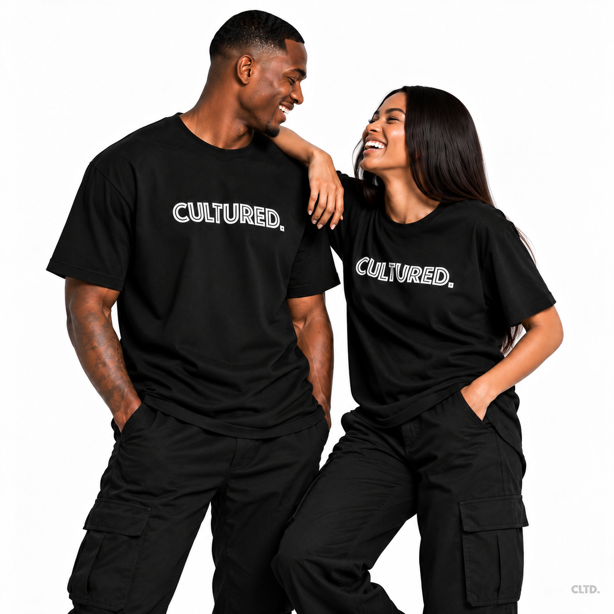 Male and female models wearing CULTURED. black T-shirts laughing together, subtle CLTD. watermark