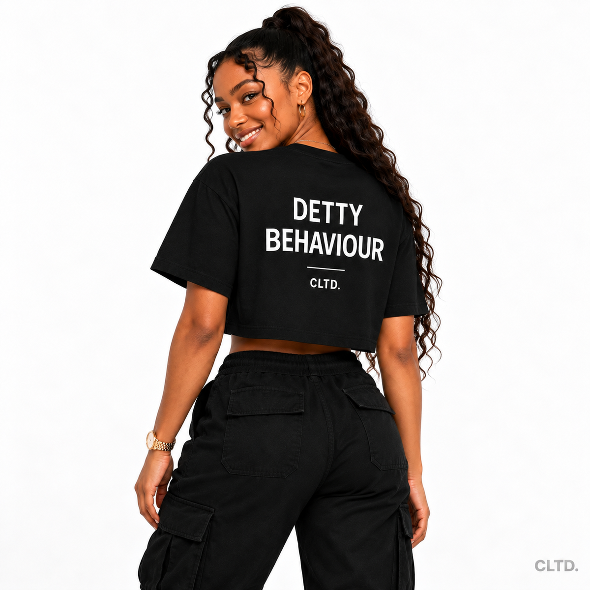 Detty Behaviour black crop top — female model back view