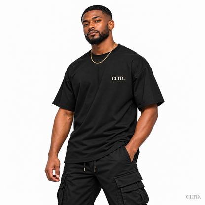 T-Shirt front view — male model wearing black The Detty Made Me Do It Style 2 with cream CLTD. chest logo
